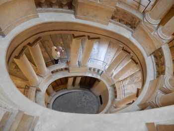 Low angle view of spiral staircase in building