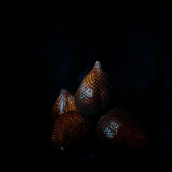 Close-up of strawberry over black background