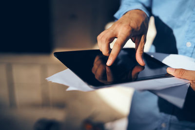 Man with tablet pc and document