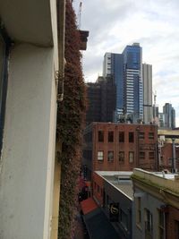 Buildings in city against sky