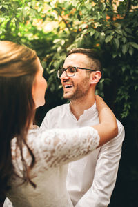 Close-up of couple embracing while standing outdoors