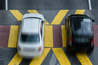 Blurred motion of yellow train on road