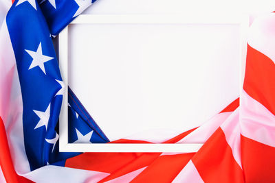 Low angle view of flag against blue background