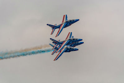 Airplane flying against sky