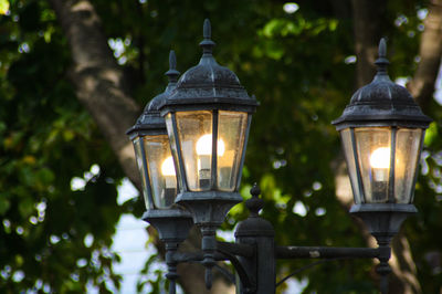 Close-up of triple light lamp post