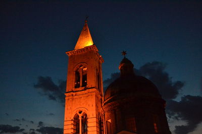 Low angle view of bell tower against sky