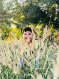 Portrait of young woman in grass