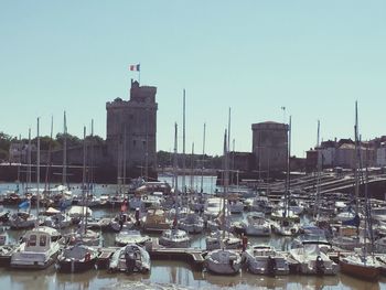 Boats moored at harbor