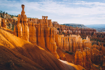 Panoramic view of rock formations against sky