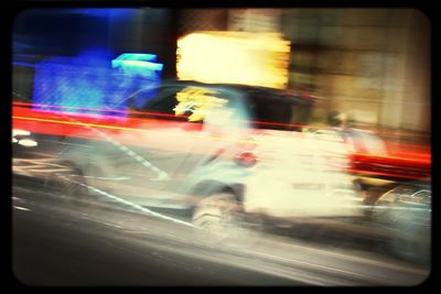 Traffic on city street at night