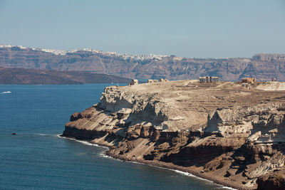 Scenic view of sea and mountains against sky