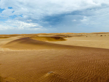 Scenic view of desert against sky