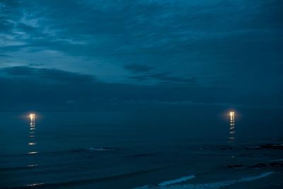 Scenic view of sea against sky at dusk