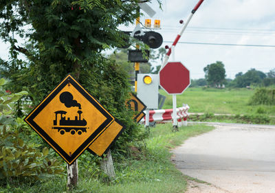 Road sign by trees