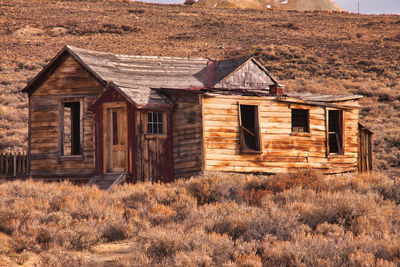 Abandoned house on field