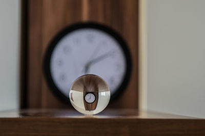 Close-up of clock on table