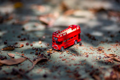 Close-up of red toy car on table