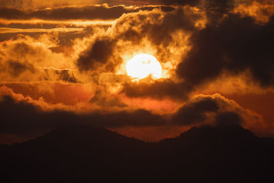 Low angle view of dramatic sky at sunset