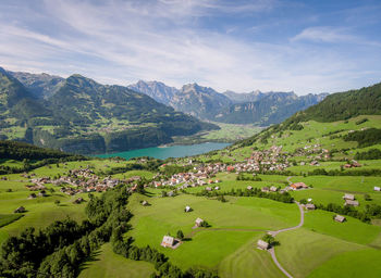 High angle view of houses and mountains against sky