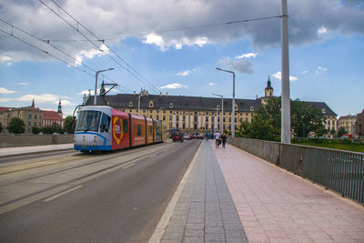 Cars on road against sky
