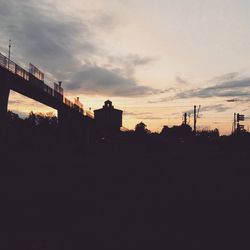 Silhouette of built structure at sunset