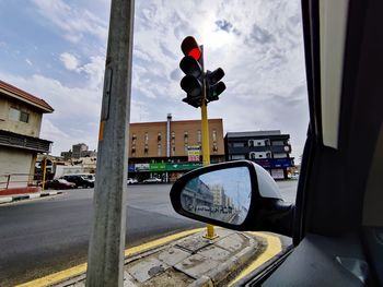 Cars on street seen through window