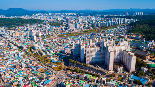 High angle view of city buildings against sky