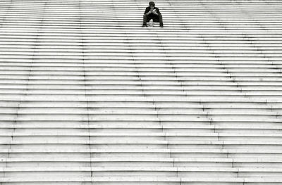 Low angle view of person walking on staircase