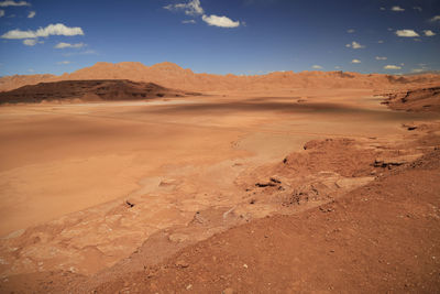 Scenic view of desert against sky during sunset
