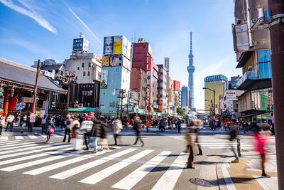 People walking on road in city