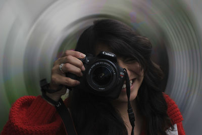 Portrait of woman photographing