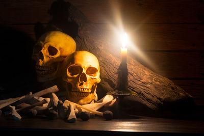 Illuminated candles on table