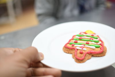 Cropped hand of person having food