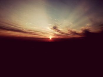 Scenic view of dramatic sky during sunset