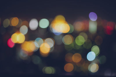 Defocused image of colorful illuminated lights at night