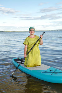 Man kayaking in sea