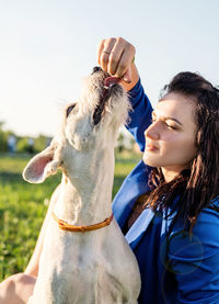 Low section of woman with dog