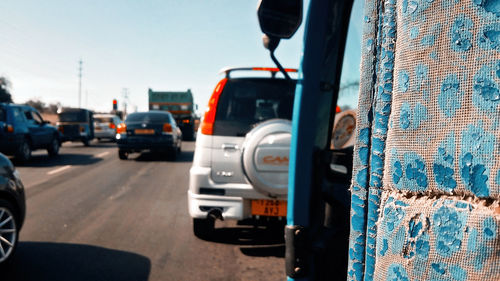 Close-up of a car on road