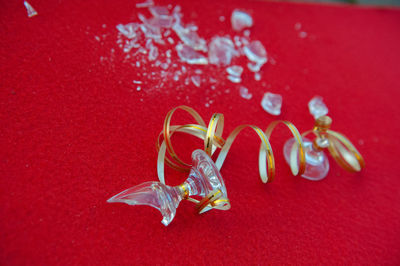 Close-up of colored pencils over red background