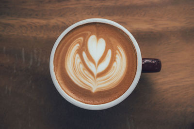 Close-up of cappuccino on table