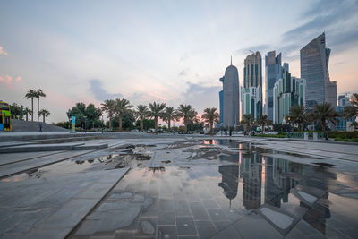 City buildings against cloudy sky