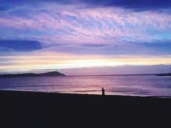 Scenic view of sea at sunset