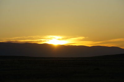 Scenic view of silhouette landscape against sky during sunset