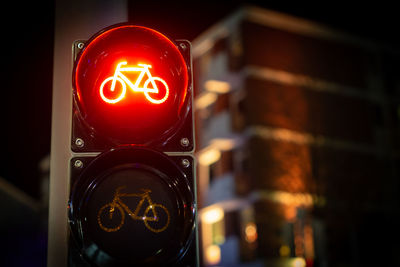 Close-up of illuminated sign on road