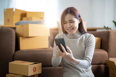 Young woman using mobile phone