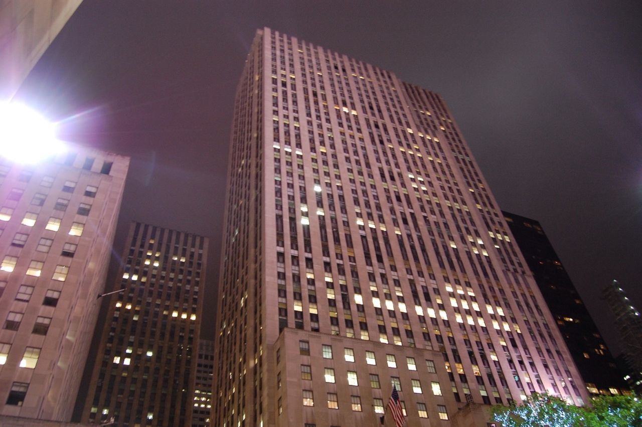 architecture, building exterior, built structure, low angle view, skyscraper, city, modern, office building, illuminated, tall - high, night, tower, sky, building, glass - material, outdoors, no people, reflection, city life, financial district