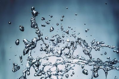 Close-up of water splashing against blurred background