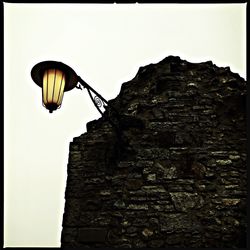 Low angle view of street light against sky