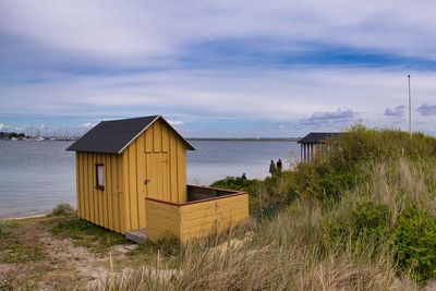 Built structure on beach against sky