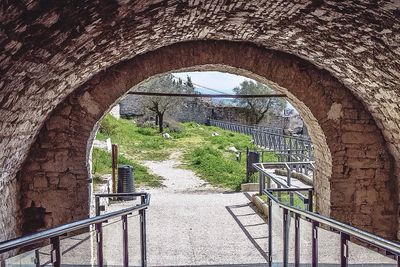 Arched walkway along trees